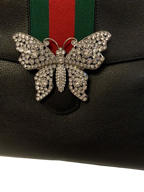 gucci totem butterfly bag|Gucci bag with butterfly buckle.